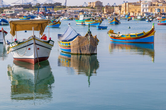 Malta, Marsaxlokk. Marsaxlokk harbor. Luzzijiet, plural of luzzu, colorful traditional Maltese fishing boats.