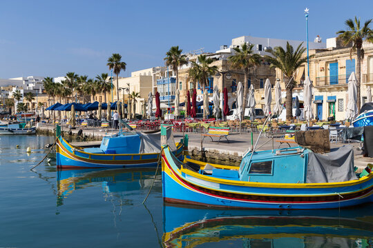Malta, Marsaxlokk. Marsaxlokk harbor. Luzzijiet, plural of luzzu, colorful traditional Maltese fishing boats.