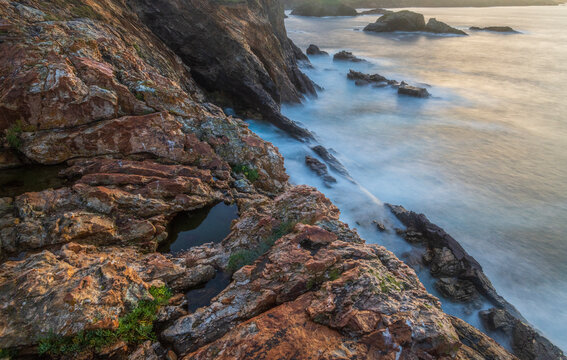 Spain, Mirador de Atalaya. Rock formations on ocean shore.