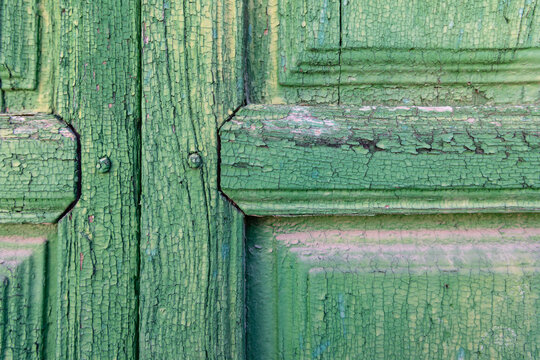 Albaicin, Province of Granada, Andalusia, Spain. Peeling green paint on an old wooden door.