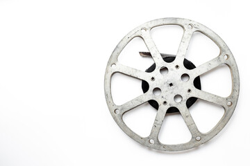 Obraz premium Old 35mm motion picture film reel on white background. Cinema concept
