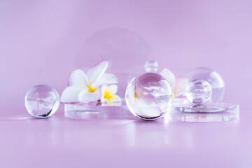 A calming display features aloe serum, centella, glass elements, and flowers for relaxation.