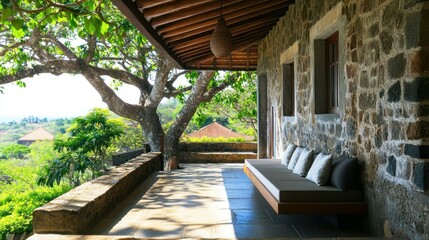 Obraz premium Stone patio with a view, shaded by a large tree