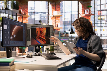 Female game developer interacts with AI powered assistant on computer, using automation to help generate a spatial video game environment. Machine learning used for creative tasks.