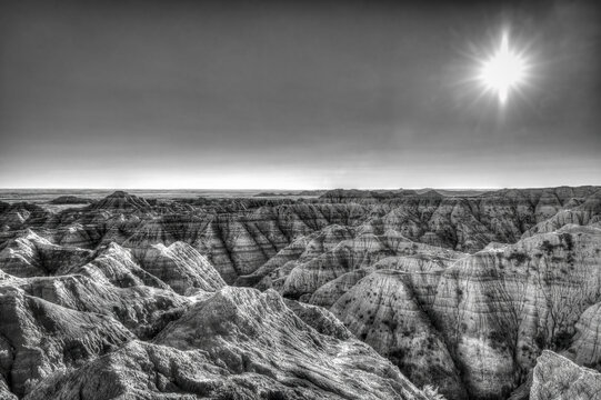 The wind and water eroded landscape in the Badlands National Park seem desolate but make for beautiful natural carvings. USA