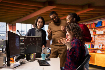 Cheerful startup team members happy after successfully launching on stock exchange, generating high...