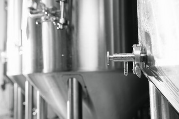 Industrial beer brewing equipment in action at modern brewery