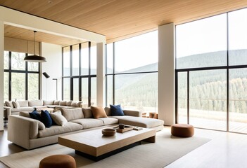 A living room filled with furniture and large windows.