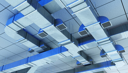 Modern air ventilation ducts on a suspended ceiling in an industrial or commercial facility, used for HVAC air distribution. HVAC. Construction. Infrastructure.
