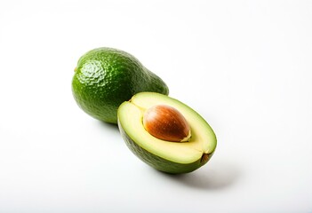 A half of an avocado next to a whole avocado.