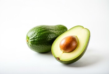 A half of an avocado next to a whole avocado.