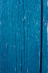Wooden boards painted in blue. Rough and cracked surface. Old wood and paint.Background and texture.