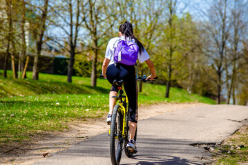 Fototapeta premium Cyclist ride on the bike path in the city Park 