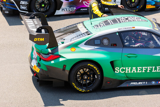 Oschersleben, Germany, May 28, 2023: Scenic view  fast Mercedes BMW Audi Lamborghini Ferrari Porsche DTM Oschersleben Motorsport Arena starting grid race track. European motors auto sport competition