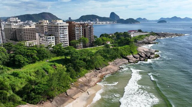 Rio De Janeiro Skyline At Arpoador Beach Rio De Janeiro Brazil. Turquoise Ocean Waves Gently Crashing On Tropical Beach. Shore Clouds Sky Beach Sea. Outdoor Beach Panning Wide.