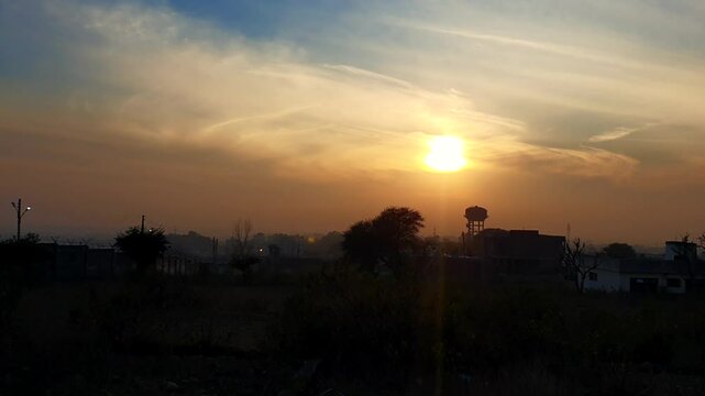 Mussoorie forest Uttarakhand winter lineis visible on the western horizon in the evening from midOctober to January. Sun sets, shades of yellow, red, orange, purple.