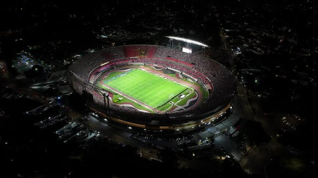 Night Soccer Stadium At Sao Paulo Brazil. Modern Football Stadium Overlooking A Dense Downtown City. Building Construction Landscape. Construction Urban Skyscrapers Corporate Town. Sao Paulo Brazil.