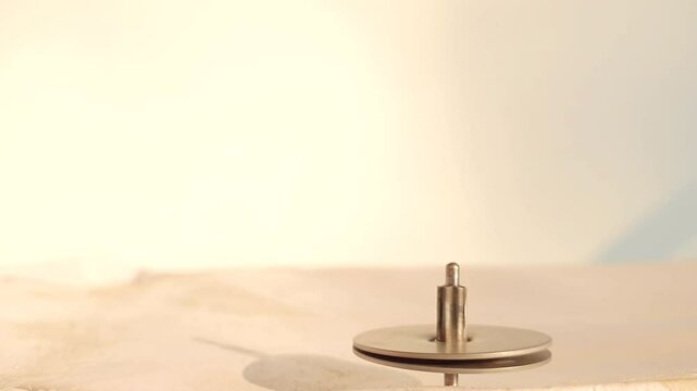Top spin iron a rounding string also called lattoo in india. Its a kids game rounding fast.