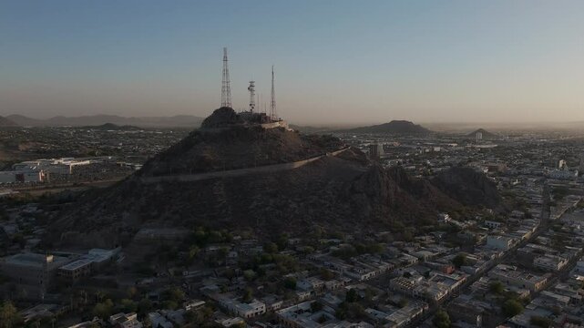 Campana hill dominating hermosillo skyline at dawn
