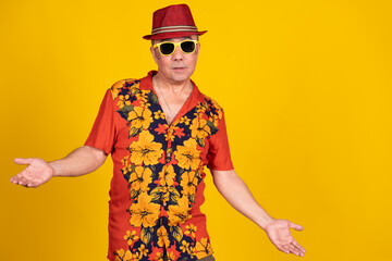 Confused tourist gesturing against yellow background