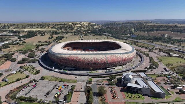 Fnb Stadium At Johannesburg Gauteng South Africa. Modern Football Stadium Overlooking A Dense Downtown City. Town Sky Backgrounds Urban. Town Outside Panorama. Johannesburg Gauteng.