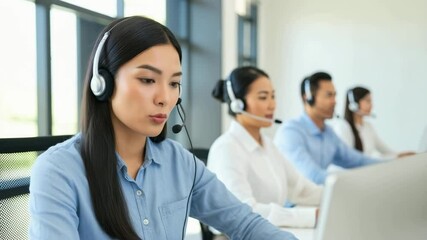 Dynamic customer support team engaged in call center operations with headsets and laptops - Powered by Adobe