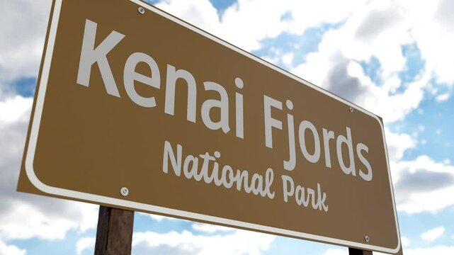Kenai Fjords National Park (Alaska) Road Sign Against Blue Sky and Clouds. One of The US National Parks Series.