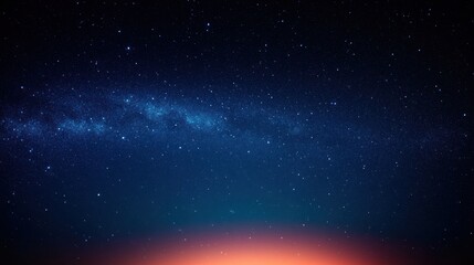 Vast night sky filled with countless bright stars and the Milky Way stretching across with a warm glowing horizon beneath