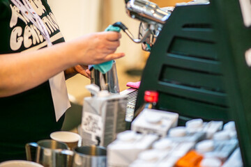 A lively scene from a coffee festival in Copenhagen, featuring baristas at work, diverse coffee cups, engaged customers, brewing techniques, and the rich culture surrounding coffee.