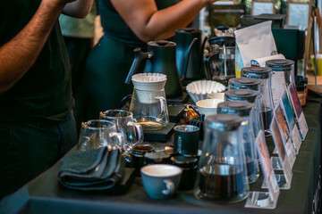 A lively scene from a coffee festival in Copenhagen, featuring baristas at work, diverse coffee cups, engaged customers, brewing techniques, and the rich culture surrounding coffee.