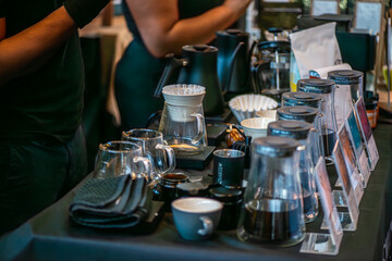 A lively scene from a coffee festival in Copenhagen, featuring baristas at work, diverse coffee...