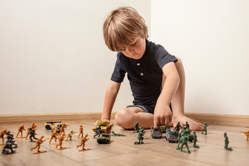 Сhildren playing with ф toy soldiers. Time for play. Free time.