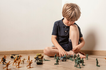 Сhildren playing with ф toy soldiers. Time for play. Free time.