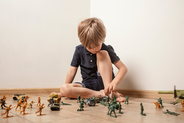 Сhildren playing with ф toy soldiers. Time for play. Free time.