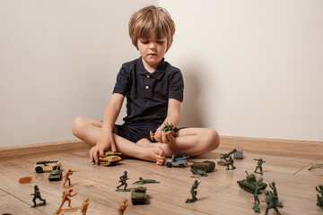 Сhildren playing with ф toy soldiers. Time for play. Free time.