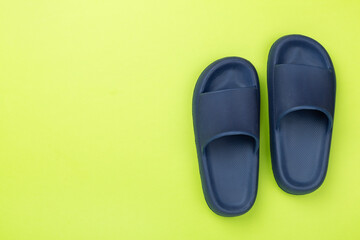 Blue sandals on color background,top view