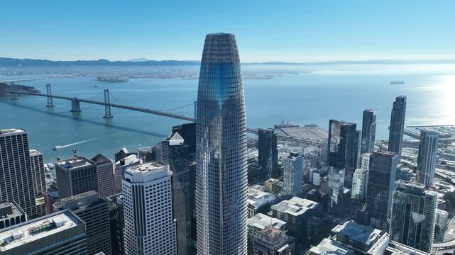 Salesforce Tower At San Francisco California United States. Highrise Building Dominating The Skyline Of The Downtown. Business Sky Background Downtown Cityscape. Backgrounds Up Above.