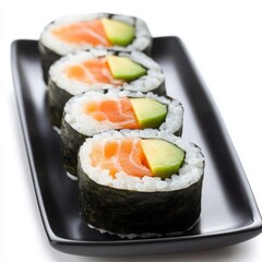 Salmon and avocado sushi rolls isolated on white background