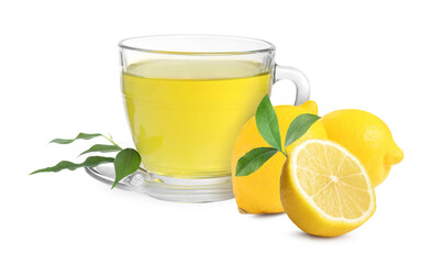 Tea in glass cup and fresh lemons on white background