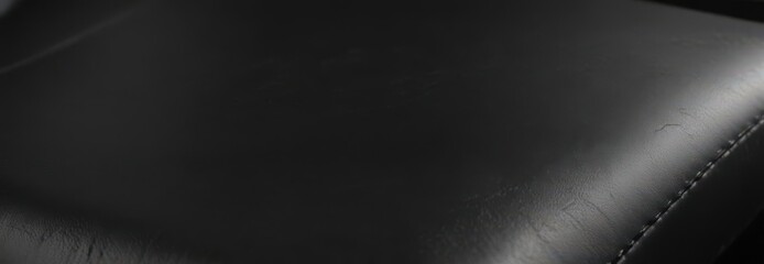 Sleek black leather, fine grain, polished finish ,  luxury,  surface