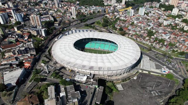 Soccer Stadium At Salvador Bahia Brazil. Modern Football Stadium Overlooking A Dense Downtown City. Infrastructure Skyline Buildings Stunning. Buildings Corporate Business. Salvador Bahia.