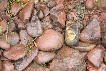 River rocks showcasing natures variety in texture and color. Abstract background diverse geological composition.
