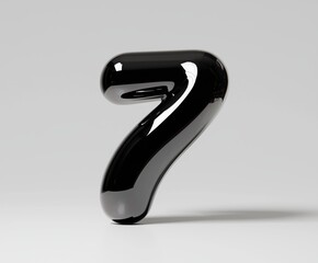 A black number seven stands tall. It is glossy and curved.