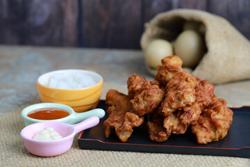 Spicy Boneless Barbecue Chicken Wings, Crispy boneless fried chicken coated in a spicy Served with hot sauce and mayonnaise, Perfect for fast food, comfort food, and restaurant themes