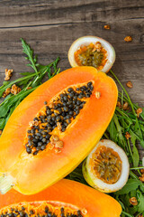 Papaya fruit on a table background. Slices of sweet papaya
