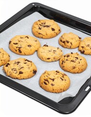 Freshly baked chocolate chip cookies on tray isolated on white background with clipping path for homemade dessert concept