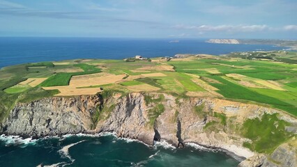 A Scenic Coastal Landscape Featuring Stunning Cliffs, Lush Farmland and Beautiful Views