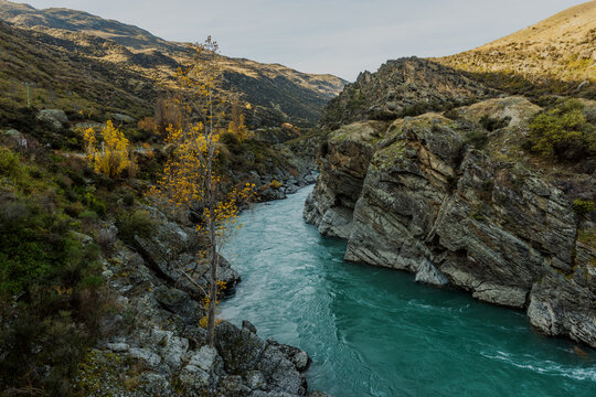 Roaring meg lookout point in Queenstown New Zealand, Autumn waterfall on sunny day