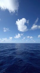 Obraz premium Calm Ocean Waters Beneath Billowing Cloudscape