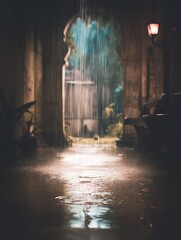 Fototapeta premium Rainy Night Scene A Pathway Through an Archway in the Rain.